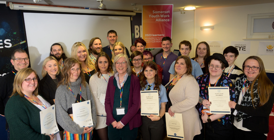 Photo of newly qualified learners with their certificates at the Somerset Youth Work Alliance event.