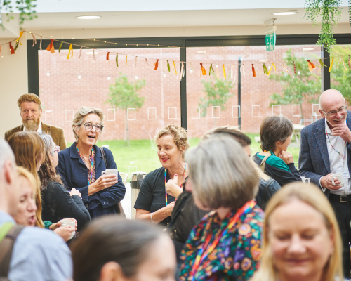 Photo of a group of people at a Spark Somerset event, smiling and networking